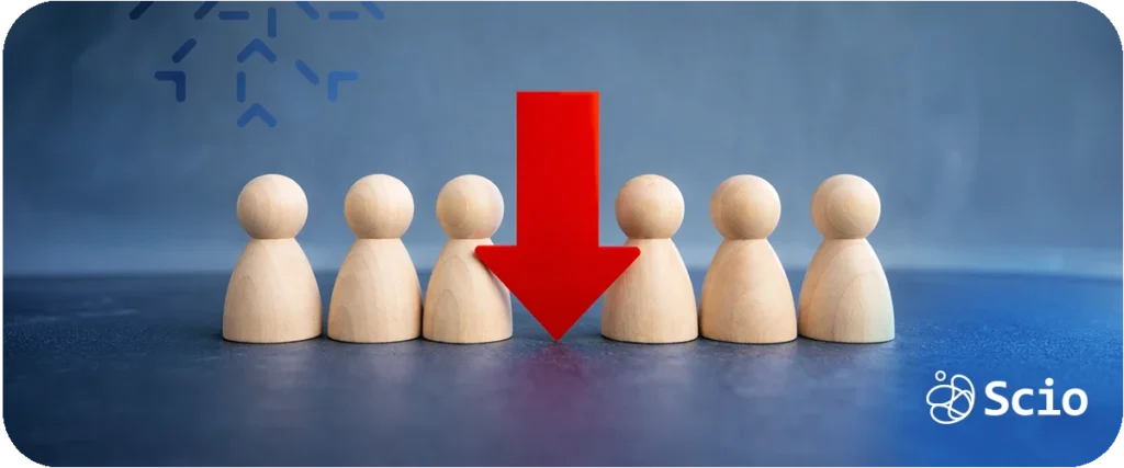 Bus factor in engineering teams: wooden figure highlighted in red among a row of figures representing single-point dependency risk and knowledge concentration in software teams