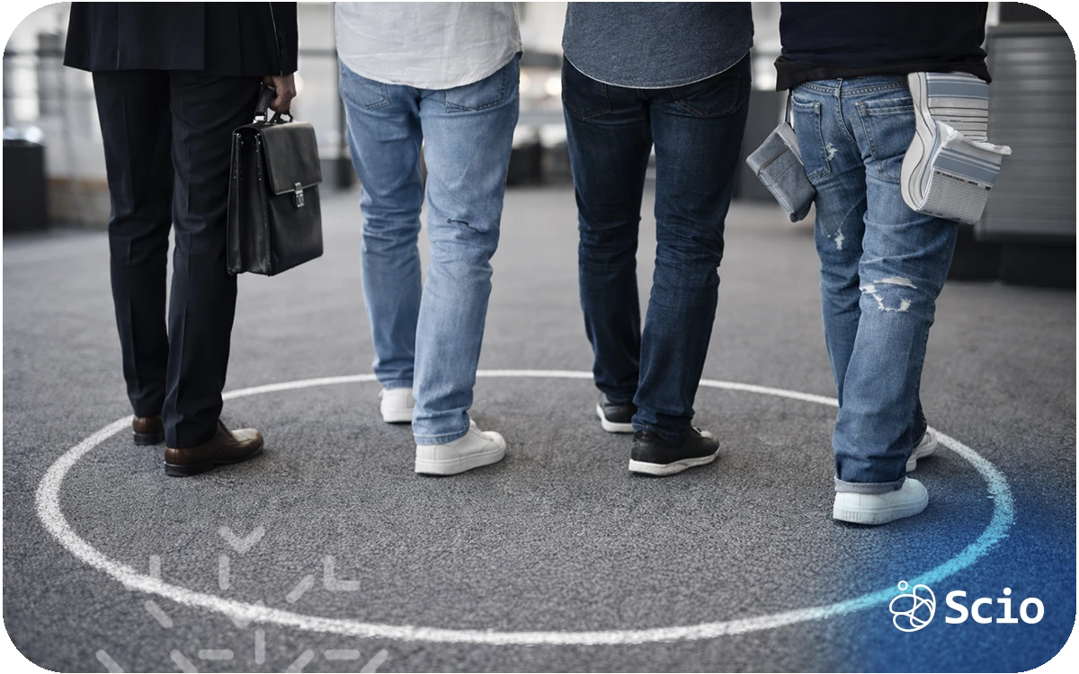 Three professionals standing inside a drawn circle on the floor, symbolizing comfort zones in engineering teams.