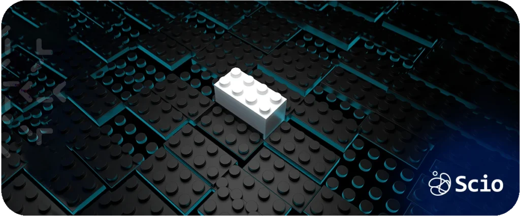 Is LEGO a programming language: white LEGO bricks arranged on a dark surface representing the modular building blocks and structured thinking that connect physical construction to software engineering
