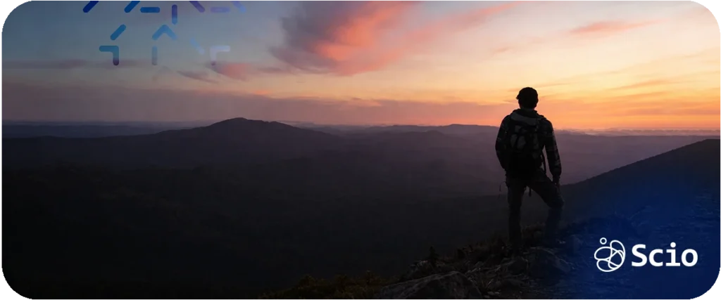 Scrum methodology lessons: engineer standing on a mountain peak at sunrise representing the leadership perspective and iterative progress principles that connect mountaineering and Agile execution