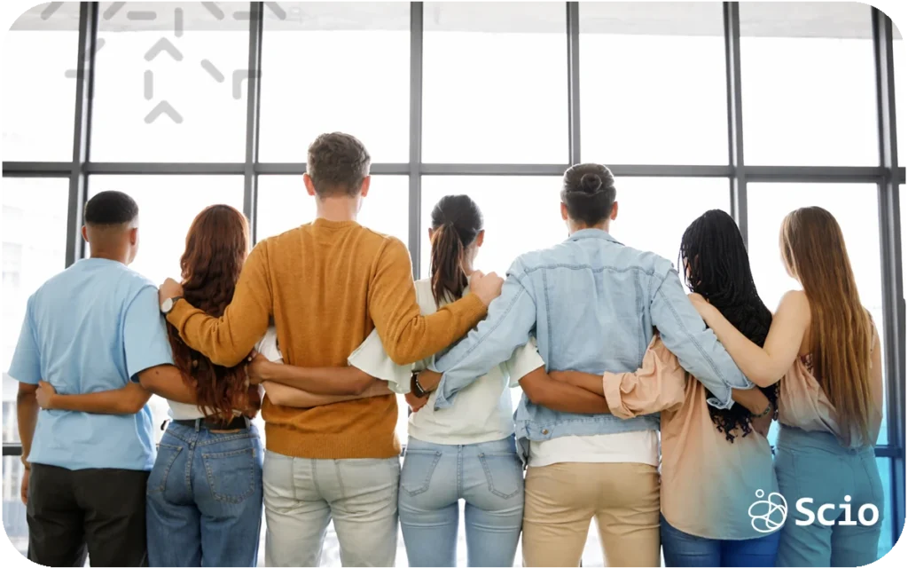 Diverse engineering team standing together with arms around each other, symbolizing unity, collaboration, and high-performance team building.