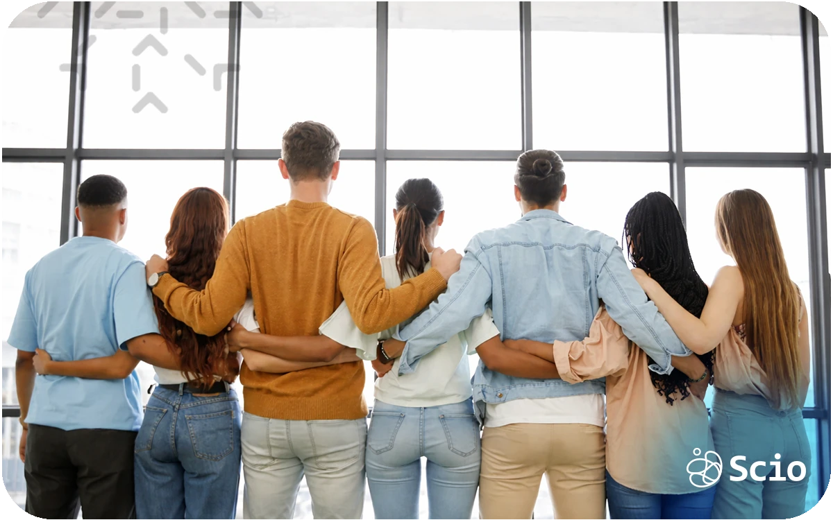 Diverse engineering team standing together with arms around each other, symbolizing unity, collaboration, and high-performance team building.
