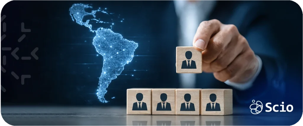 EOR vs nearshore development: executive placing a team member block while a digital map of Latin America glows representing the international team expansion decision