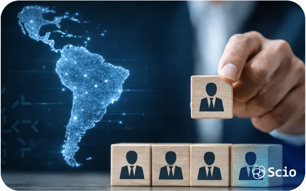 Executive placing a team member block while a digital map of Latin America glows in the background, symbolizing international team expansion.