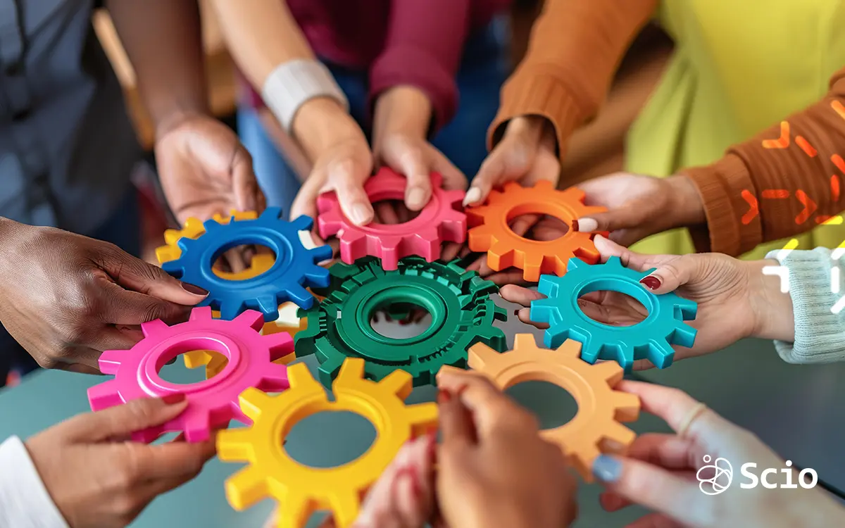 Connected Teamwork: Building the Future of Work Together A diverse group of hands connecting colorful gears—symbolizing collaboration, unity, and the collective future of hybrid work.