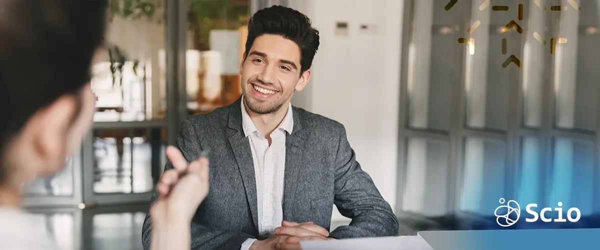 LatAm Developer Interview – Scio Blog on Better Augmentation Smiling candidate during a nearshore technical interview, representing staff augmentation from Latin America