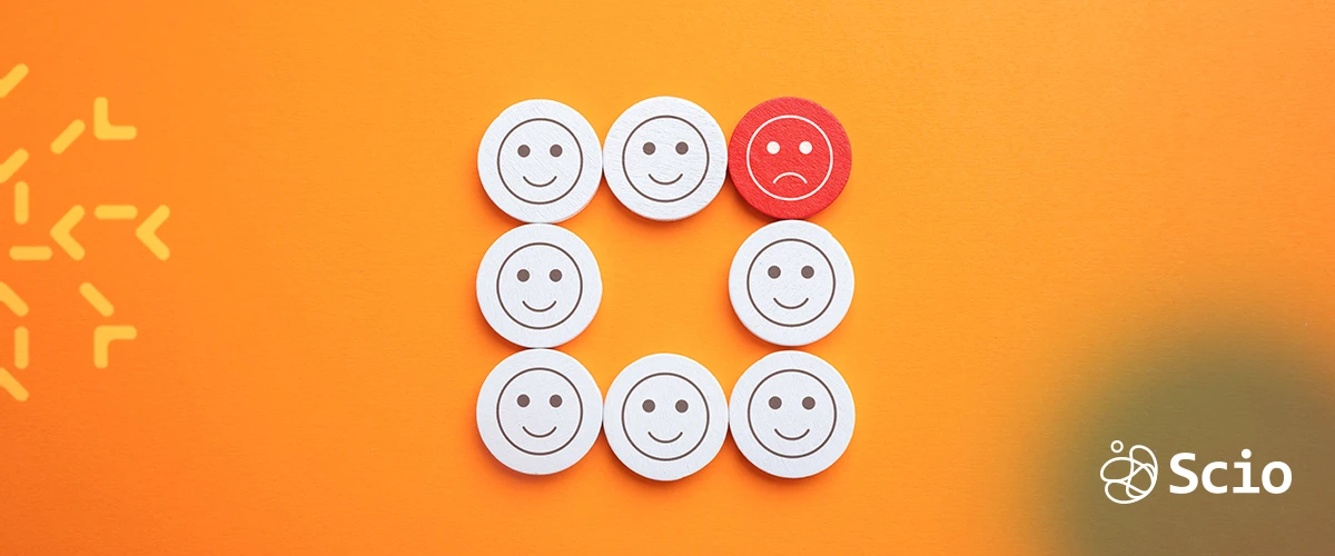 Emotional Labor in Software Teams – Scio Illustration of emotional labor in software teams showing happy and stressed faces, symbolizing the hidden work of managing emotions at work.