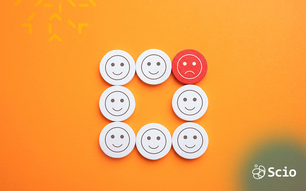 Illustration of emotional labor in software teams showing happy and stressed faces, symbolizing the hidden work of managing emotions at work.