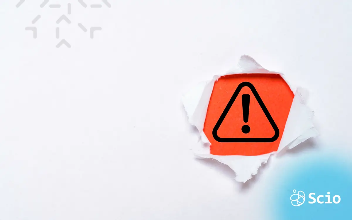 Red alert icon symbolizing IT security risks in modern businesses.