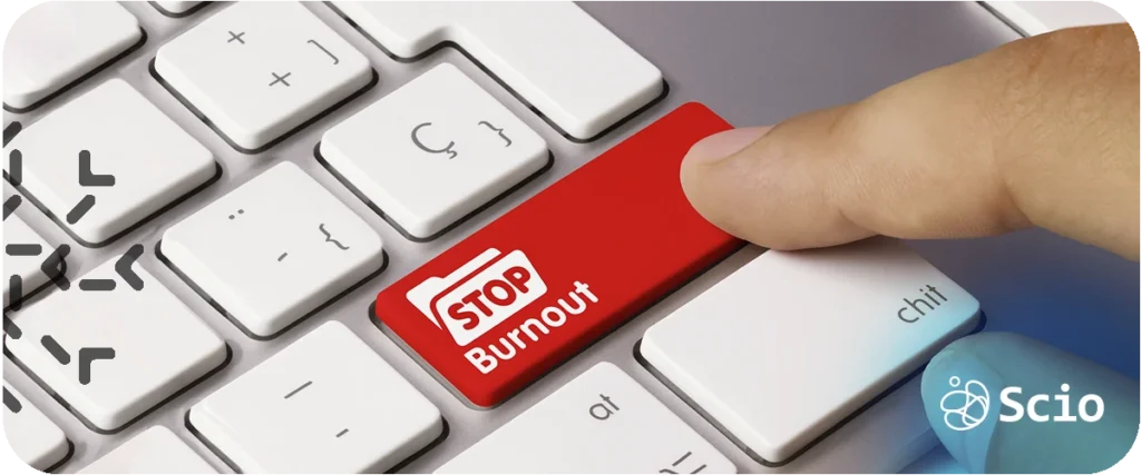 Burnout prevention in software teams: keyboard key labeled Stop Burnout being pressed representing the early detection and prevention practices that protect software engineering team performance