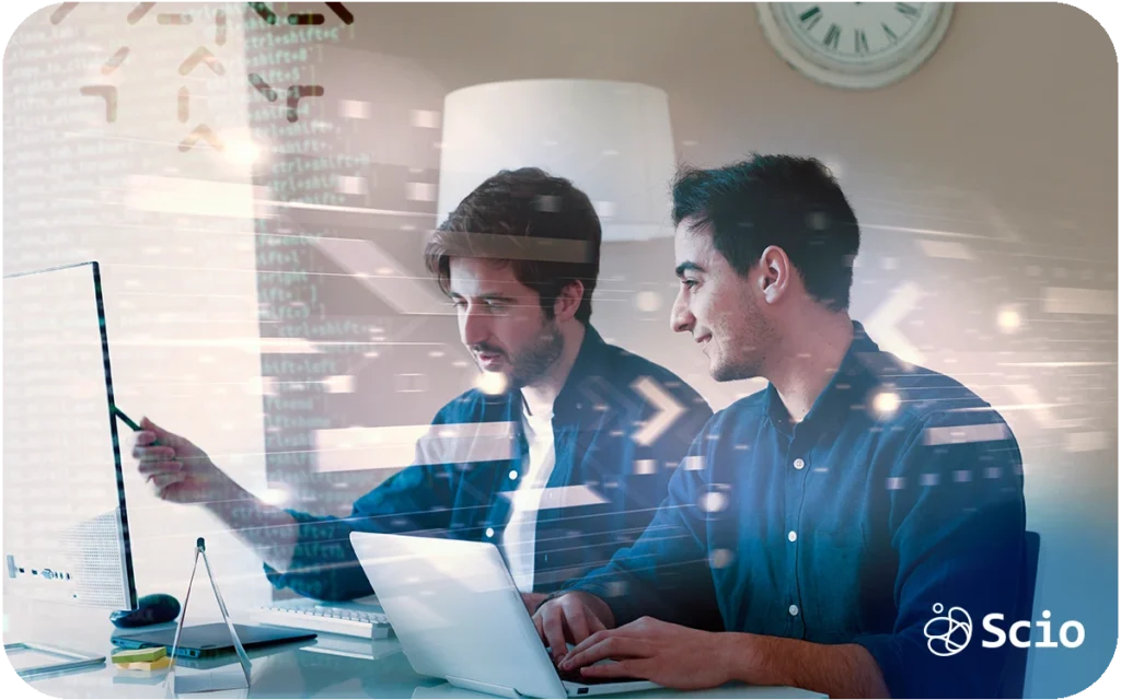 AI amplifying collaboration between two software engineers reviewing code and architecture decisions