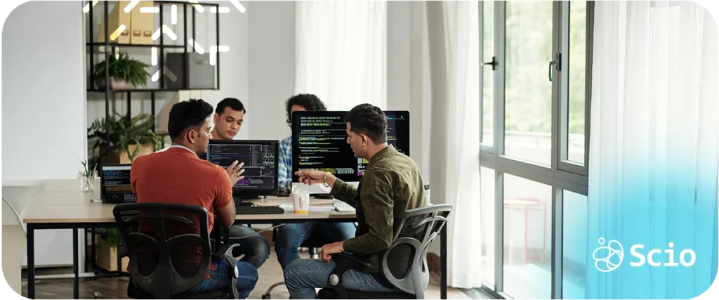 Software development skills beyond code: engineering team in collaborative discussion representing how communication, judgment, and collaboration determine real delivery outcomes beyond technical execution