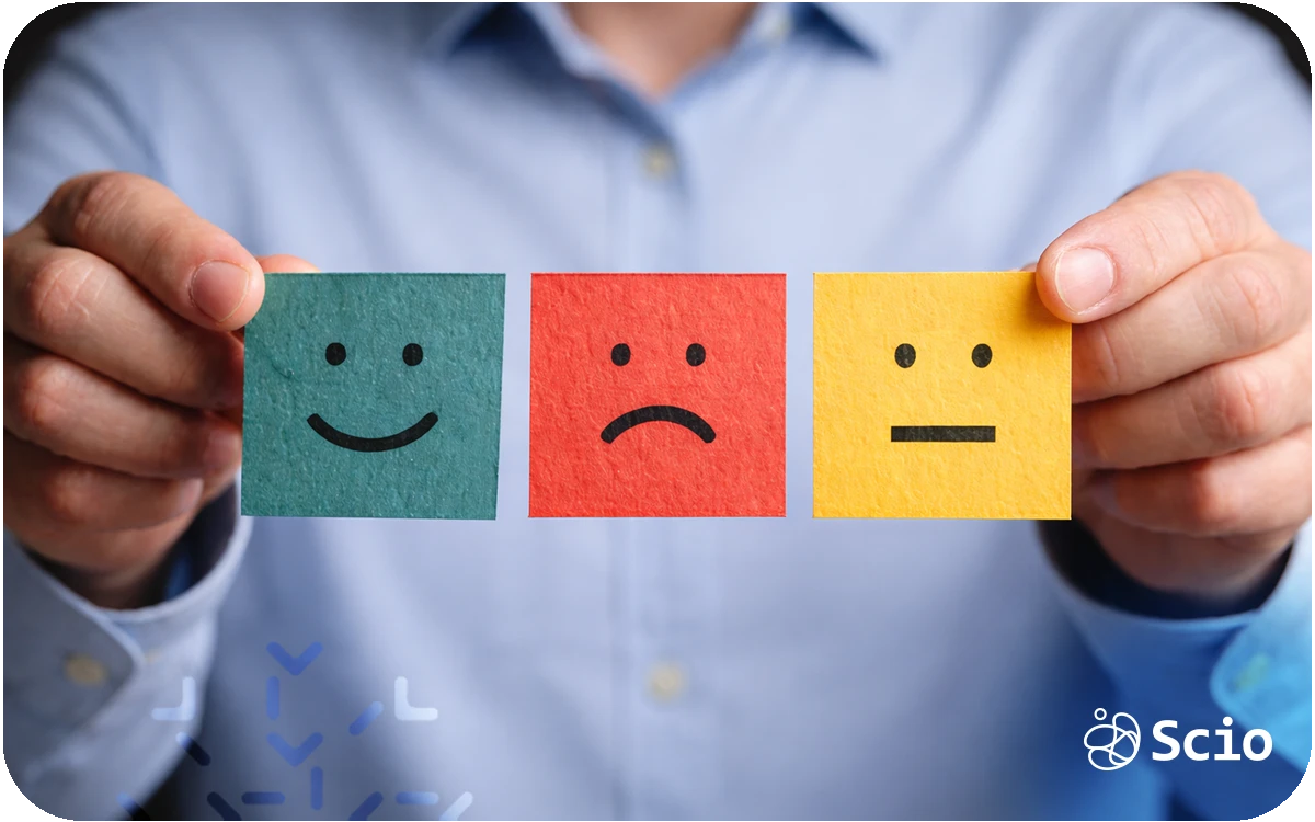 Engineering leader holding emotion cards representing the hidden emotional cost of leadership and empathy fatigue