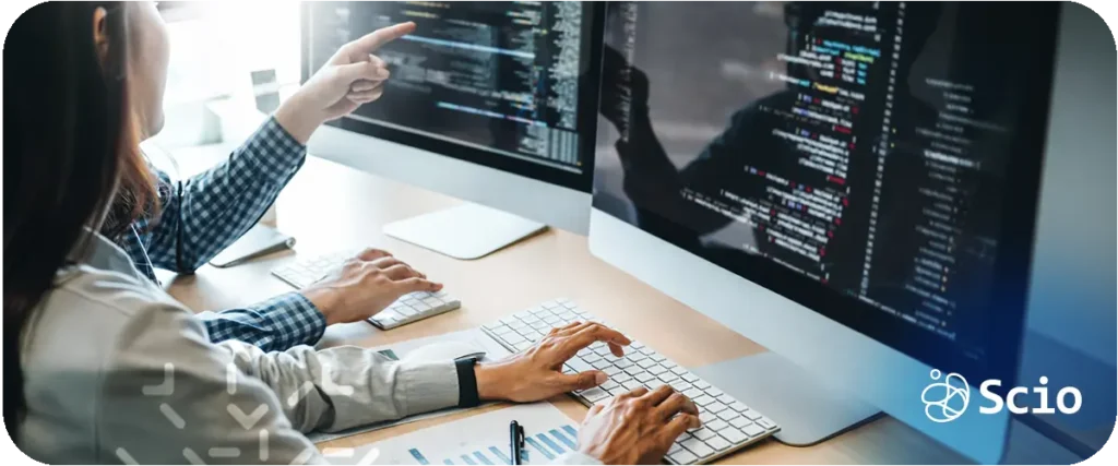 Developer in a technical discussion with product and design stakeholders demonstrating software development skills beyond programming including communication, trade-off articulation, and alignment