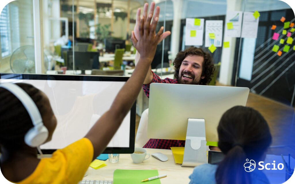 Developer recognition: engineering manager acknowledging a team member in a distributed software team representing intentional recognition culture that keeps developers engaged