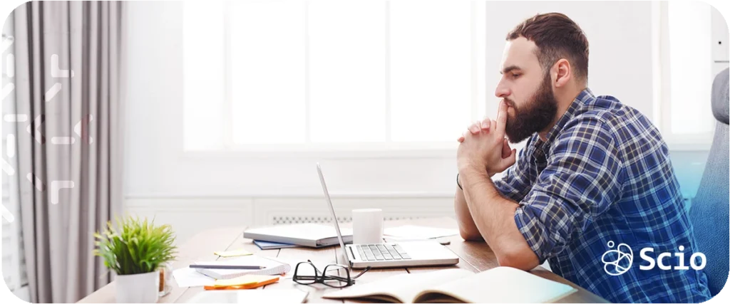 Engineering leadership at scale: CTO or VP of Engineering at a desk representing the accumulated cognitive load and strategic drag that scaling organizations create for engineering leaders