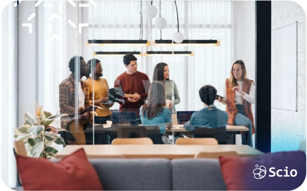 Engineering team collaborating in a modern office meeting room, representing a culture where everyone contributes.