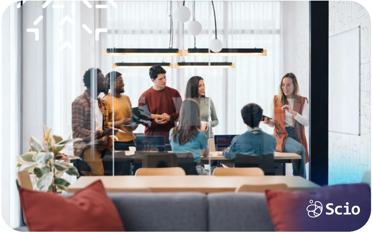 Engineering team collaborating in a modern office meeting room, representing a culture where everyone contributes.