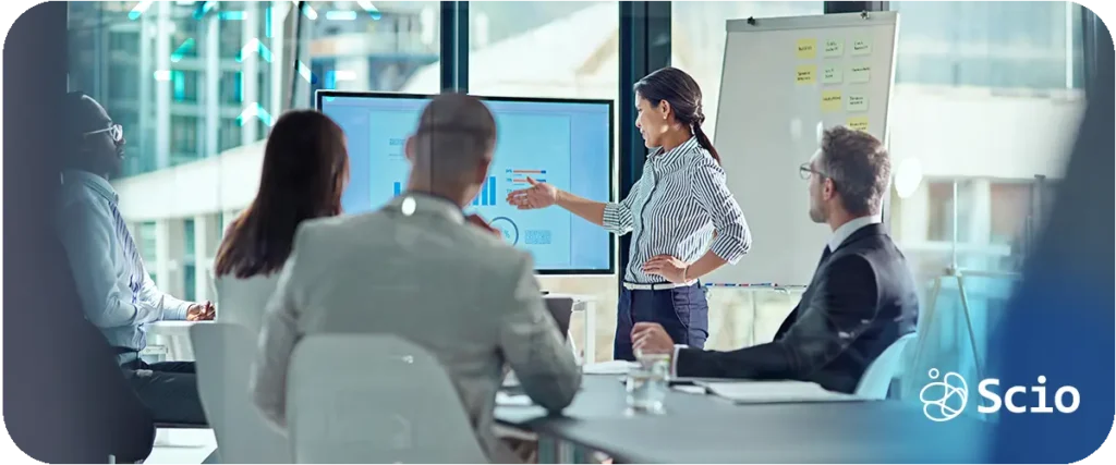 Engineering team analyzing AI performance data and discussing results during a strategy meeting.