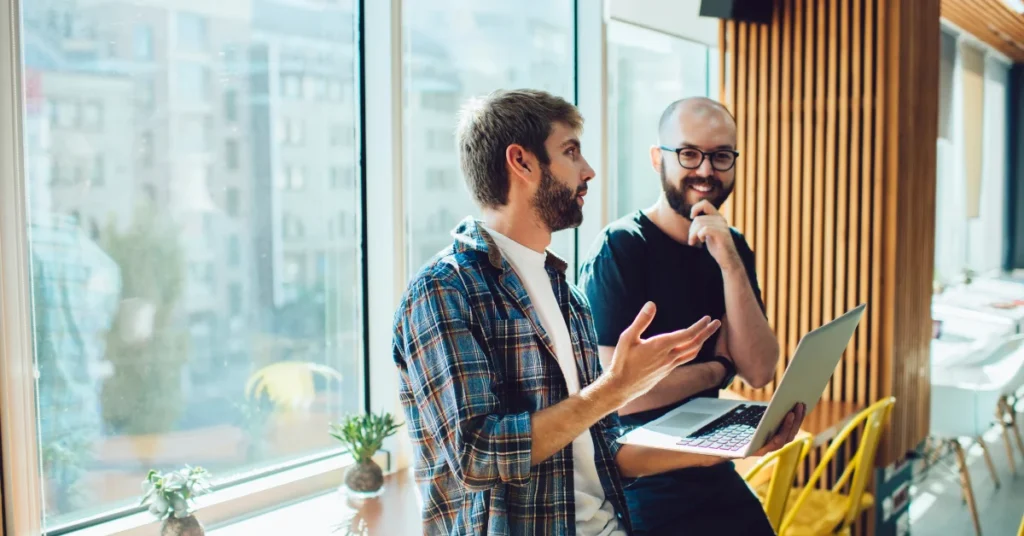 Post-acquisition platform stabilization: PE operating partner reviewing a risk dashboard representing the first 90 days of establishing control over a newly acquired software platform